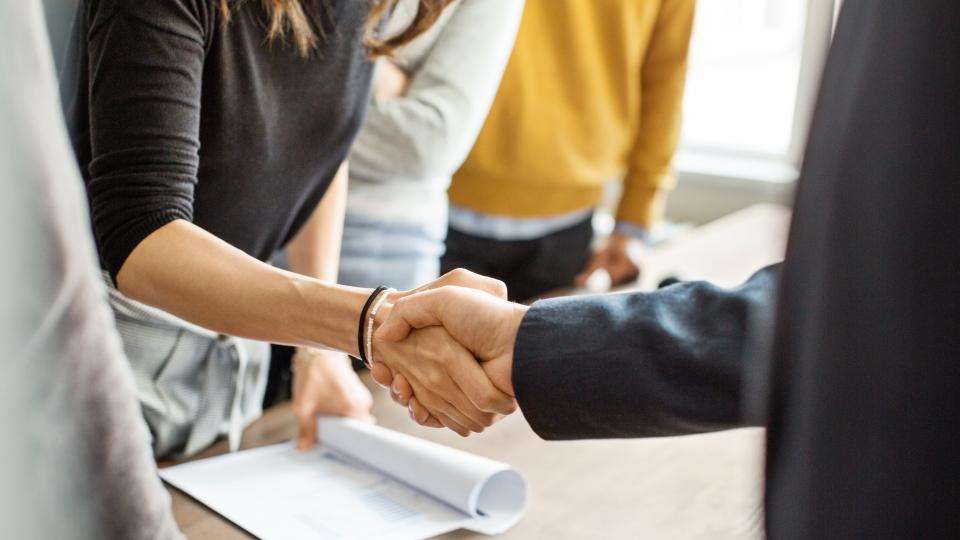 A handshake between a man and a woman